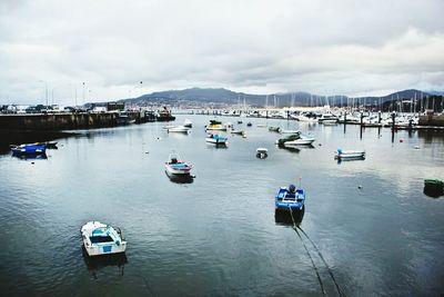 Boats moored at harbor