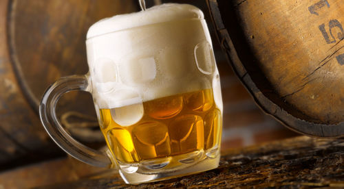 Close-up of beer glass on table