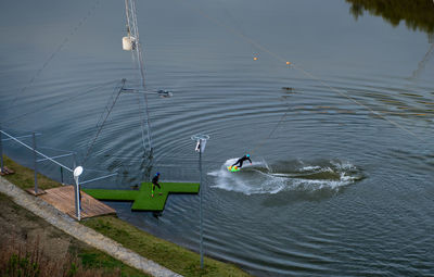 High angle view of people diving in lake