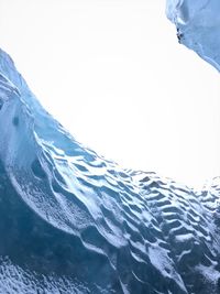 Close-up of icicles against clear sky