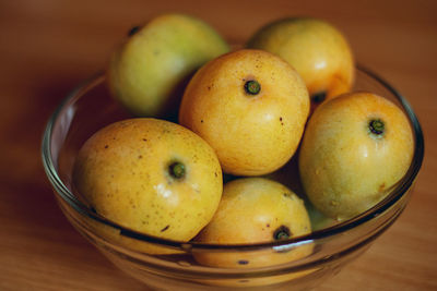 High angle view of fruits in basket on table