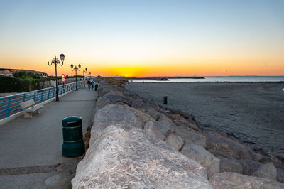 Scenic view of sea against clear sky during sunset