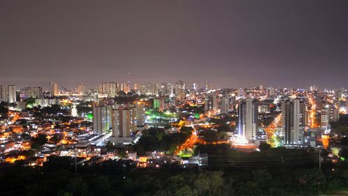 Illuminated buildings in city at night