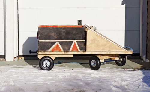 Children who built a box car that had been left in the snow