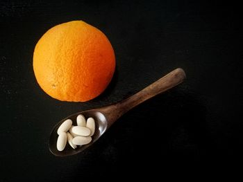 Close-up of fruit over black background