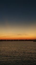 Scenic view of sea against sky at sunset