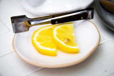 High angle view of fruits in plate on table