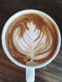 Close-up of cappuccino on table