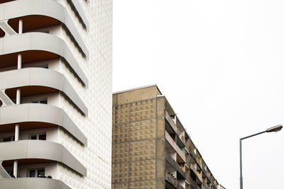 Low angle view of modern building against clear sky