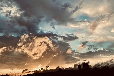 Low angle view of dramatic sky during sunset