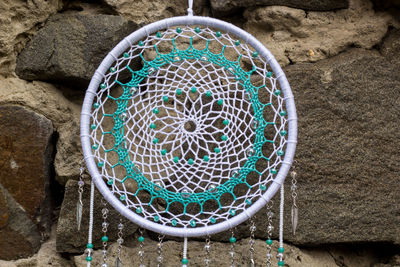 Close-up of dreamcatcher hanging outdoors