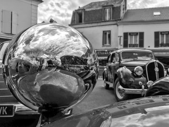 Close-up of vintage car on city street