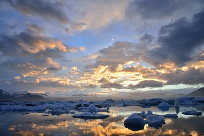 Scenic view of snow against sky during sunset