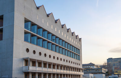 Low angle view of modern buildings against sky