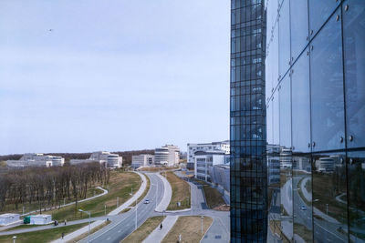 City street and buildings against sky