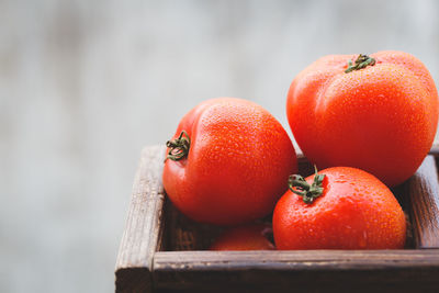 Tomatoes in wooden container