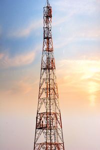 Low angle view of electricity pylon against sky