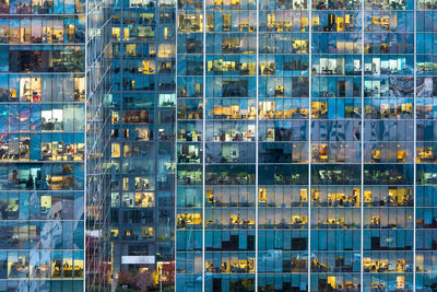 Digital composite image of modern glass building in city