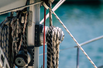 Close-up of rope tied up of metal chain