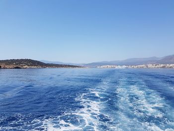 Scenic view of sea against clear blue sky