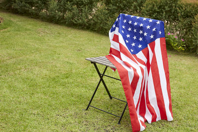 American flag on chair in yard