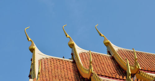 Low angle view of building against blue sky