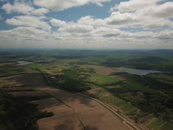 Aerial view of agricultural landscape against sky