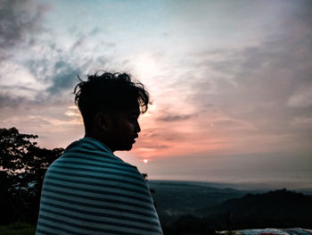 Man looking at sunset