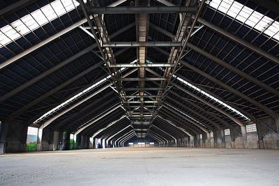 Interior of empty road amidst buildings