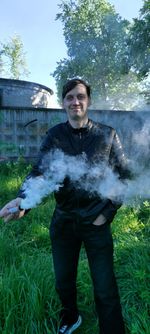 Portrait of man standing on field