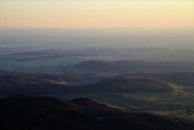 Aerial view of landscape against sky during sunset