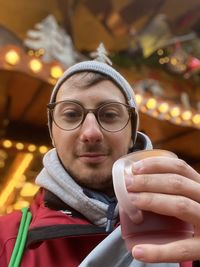 Portrait of young woman using mobile phone