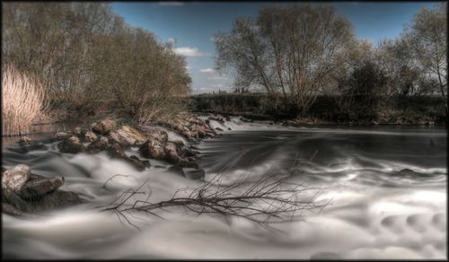 Scenic view of river against sky