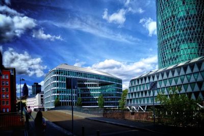 Modern buildings in city against sky