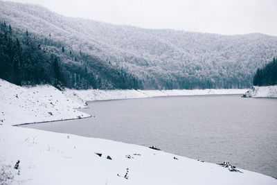 Scenic view of frozen lake against sky