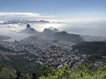 High angle view of buildings in city against sky
