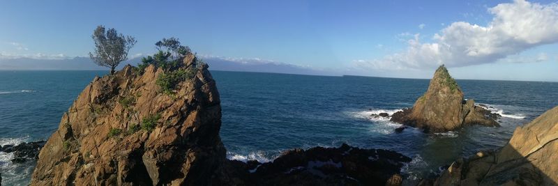 Panoramic view of sea against blue sky