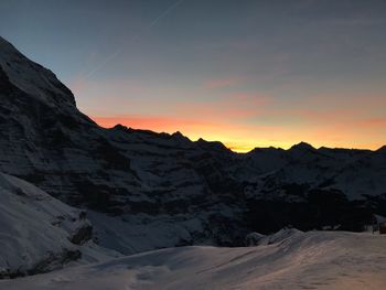 Scenic view of mountains against sky during sunset