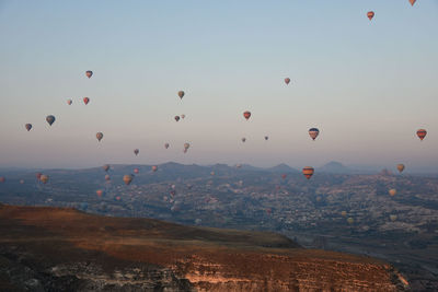 Hot air balloons in the sky over goreme in cappadocia, turkey on a sunsrise
