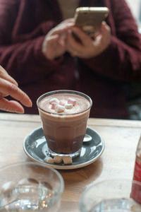 Close-up of woman holding coffee cup