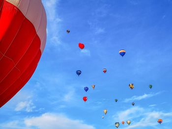 Low angle view of balloons flying in sky