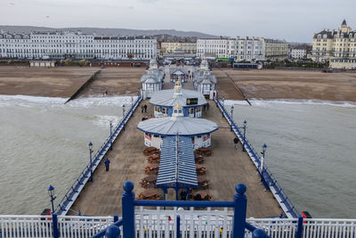 High angle view of eastbourne pier at beach against sky