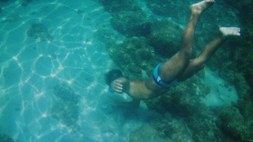 High angle view of man swimming in sea