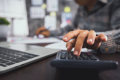 Man using laptop on table