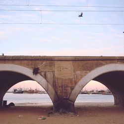 Bridge over water against sky