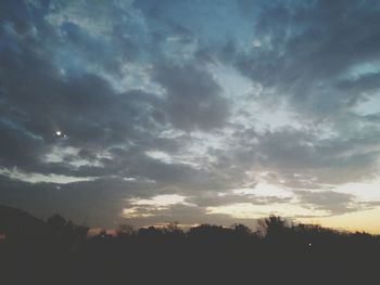 Scenic view of landscape against cloudy sky