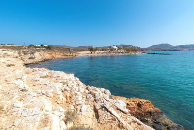 Scenic view of sea against clear blue sky