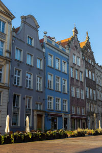 Low angle view of residential building against blue sky
