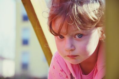 Close-up portrait of cute girl at park