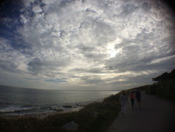 Scenic view of sea against cloudy sky